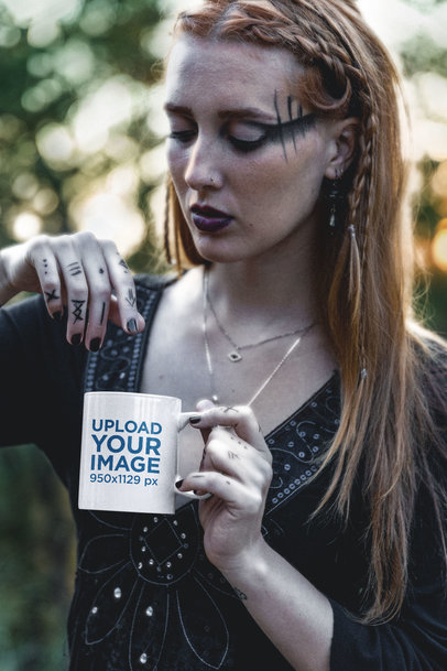 Mockup of a Woman with Hand Tattoos Holding an 11 oz Coffee Mug