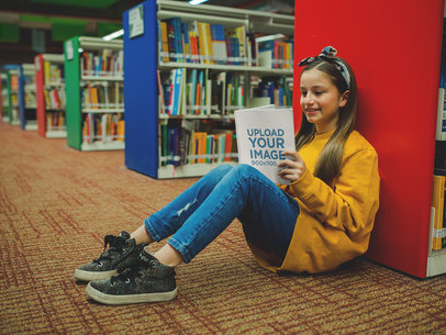 Girl with a Yellow Sweater Reading a Book Mockup Sitting at the Library