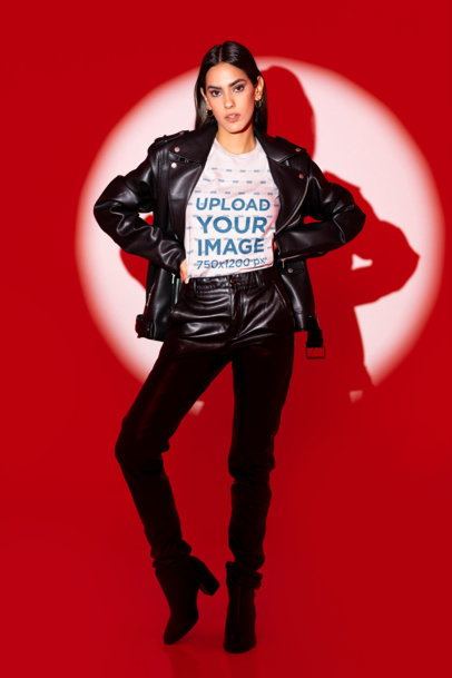 Bella Canvas T-Shirt Mockup Featuring a Serious Woman Posing Against a Red Light Studio