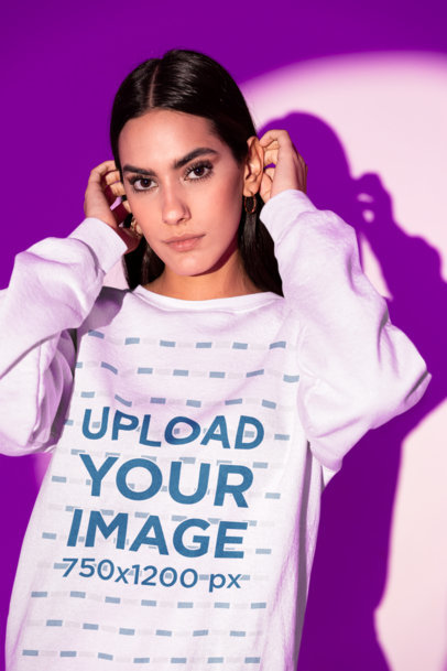 Round-Neck Sweatshirt Mockup of a Woman Posing in the Spotlight