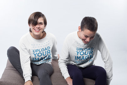 Mockup of a Happy Couple Wearing Crewneck Sweatshirts in a White Room a19980