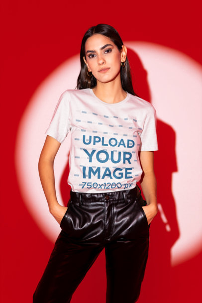 Bella Canvas T-Shirt Mockup of a Woman Posing Against a Red Lighting