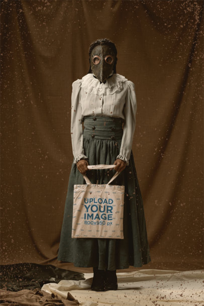 Tote Bag Mockup of a Woman Wearing a Vintage Outfit with a Creepy Mask