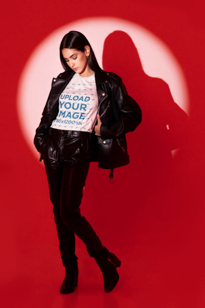Round-Neck Tee Mockup of a Woman with Leather Garments Standing on a Spotlight