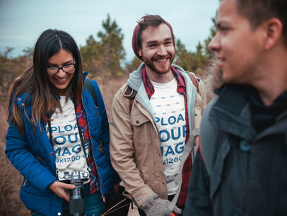 Man and Woman Wearing T-Shirts Mockup with Friends Outdoors