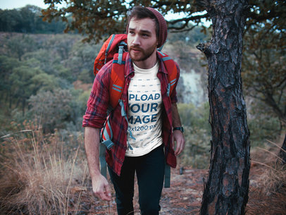 Man Wearing a Tshirt Mockup Trekking at the Mountains