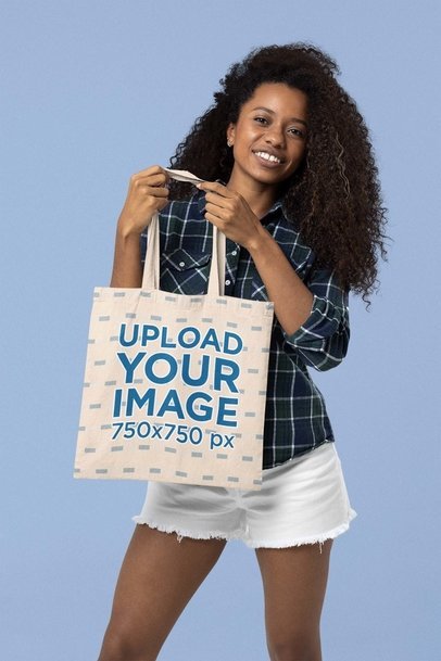 Sublimated Tote Bag Mockup of a Smiling Woman with Curly Hair