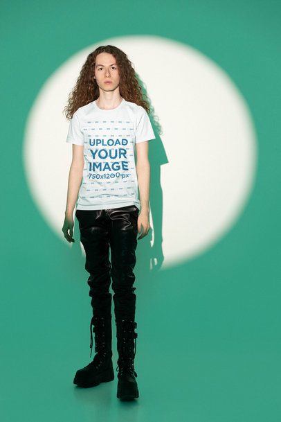 Bella Canvas Tee Mockup of a Man with Long Curly Hair Posing in a Spotlight