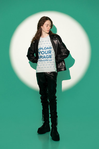 Bella Canvas Tee Mockup of a Man with Long Hair Posing in a Spotlight