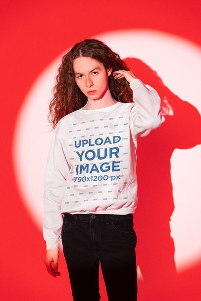 Round-Neck Sweatshirt Mockup of a Man with Long Hair Standing in the Spotlight