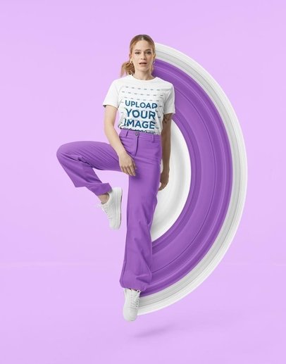 Round-Neck Bella Canvas Tee Mockup of a Woman Jumping in a Studio