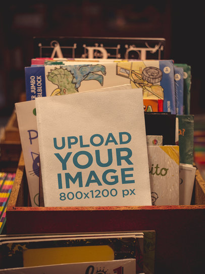 Book Mockup Standing Against Other Books on a Shelf