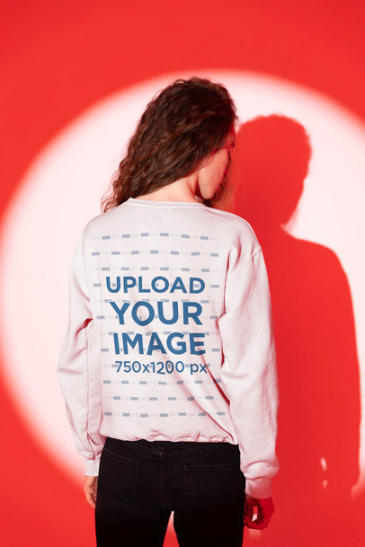 Back-View Sweatshirt Mockup of a Man with His Shadow Projected in the Background m29000