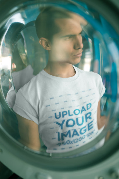 Through a Glass Mockup of a Man Wearing a T-Shirt at a Laundry