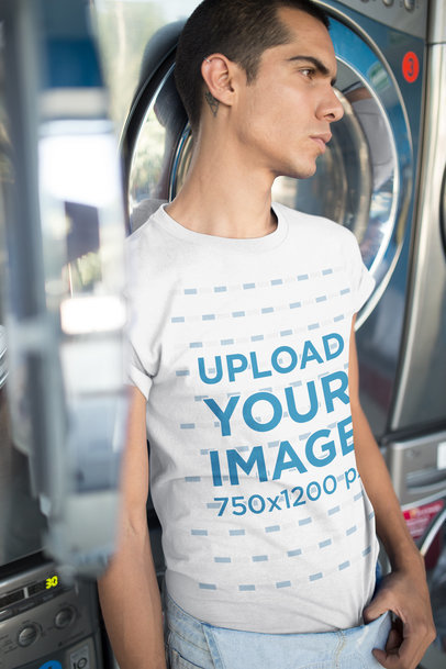 Man Wearing a Round Neck T-Shirt Mockup Leaning Against a Washing Machine a19699