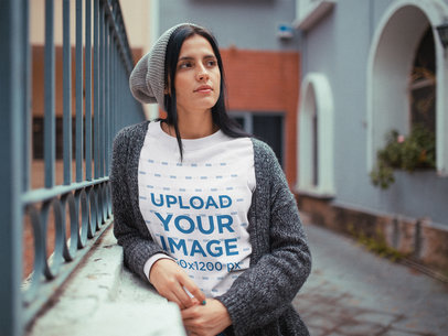 Woman Wearing a Winter Crewneck Sweatshirt Template while Standing Outside her House