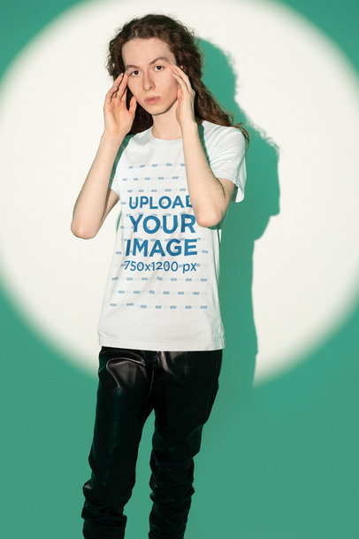 Mockup of a Man with Long Hair Wearing a Bella Canvas T-Shirt at a Studio
