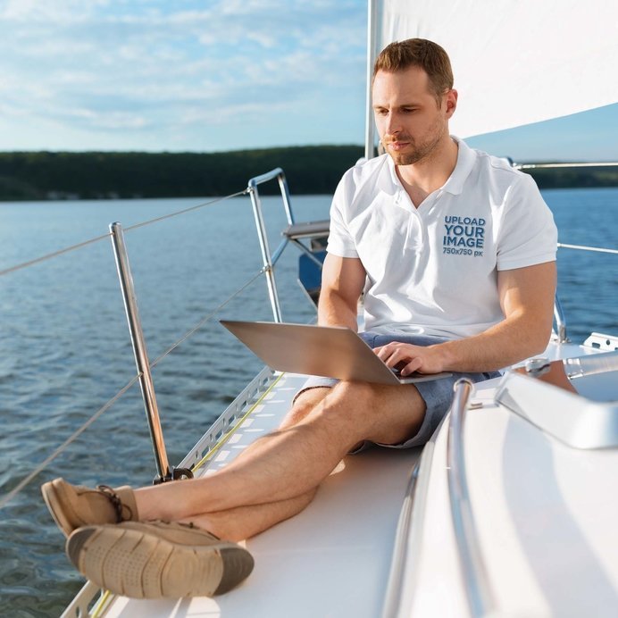 Polo Shirt Mockup of a Man Using His Laptop on a Boat
