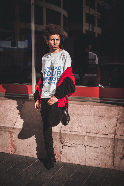 Dude with an Afro Wearing a T-Shirt Mockup Waiting for the Bus a18910