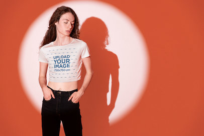 Bella Canvas Crop Top Mockup of a Man Posing Against an Orange Light