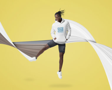 Pullover Hoodie Mockup of a Man with Braids Jumping in the Air