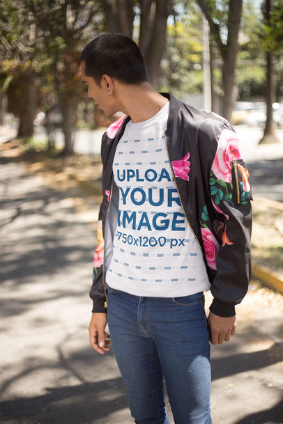 Man Wearing a Tshirt Mockup Walking at the Park a19711