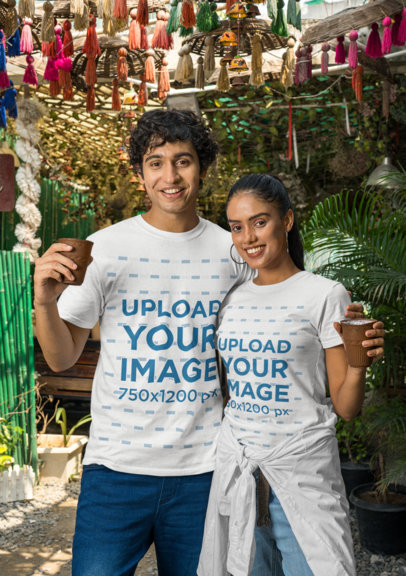 Gildan T-Shirt Mockup Featuring a Happy Man and Woman Holding Ceramic Glasses
