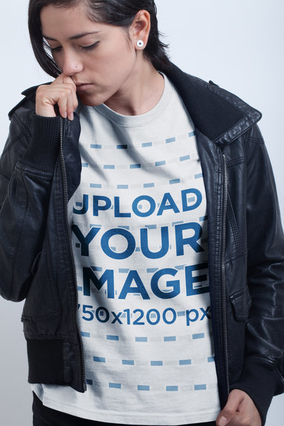 Serious Woman Wearing a Tshirt Mockup and a Leather Jacket