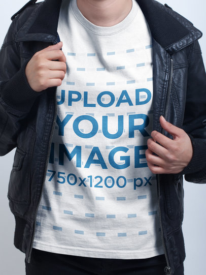 Closeup of a T-Shirt Mockup Being Worn Below a Dark Jacket