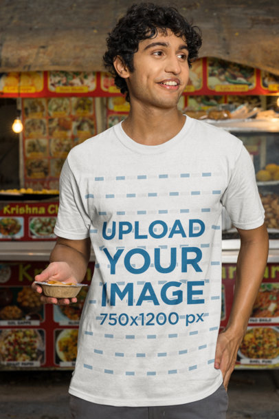 Gildan T-Shirt Mockup Featuring a Smiling Man With an Indian Food Snack