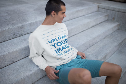 Man Sitting on Concrete Stairs Wearing a Sweater Mockup a19709