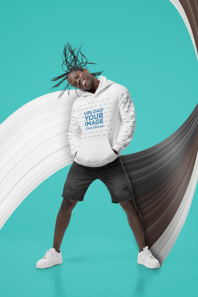 Hoodie Mockup Featuring a Happy Man Whipping His Hair at the Studio