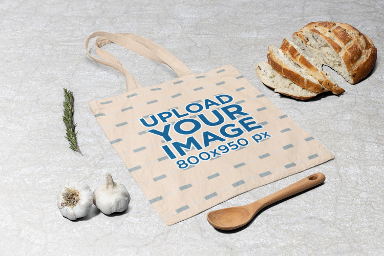 Mockup of a Tote Bag Surrounded by Bread and Onions