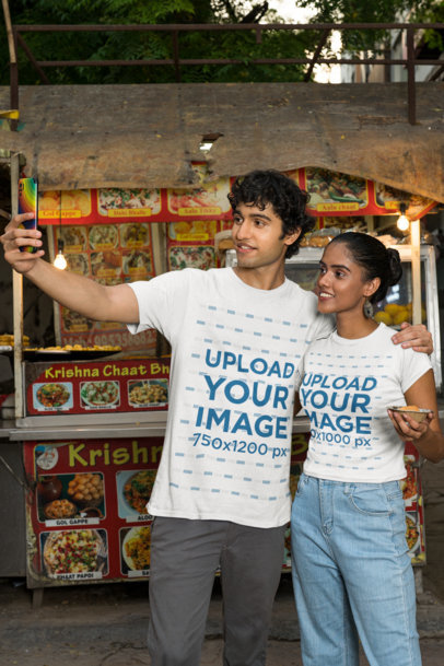 Gildan T-Shirt Mockup of a Happy Couple Taking a Selfie by a Food Cart