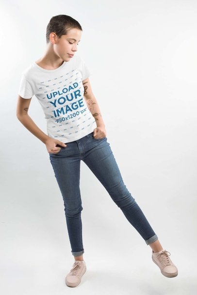 Tattooed Woman Wearing a T-Shirt Mockup in a Photo Studio