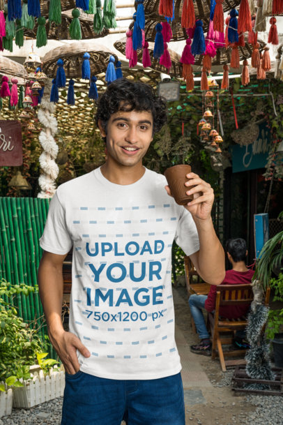 Mockup of a Man in a Gildan T-Shirt Posing in a Street Food Market