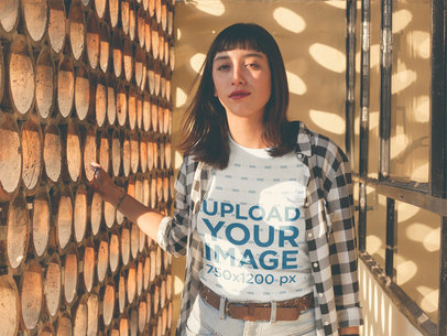 Woman Wearing a T-Shirt Mockup in a Room with Dots Shaped Light a18995