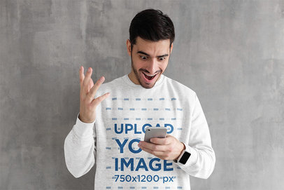 Heathered Sweatshirt Mockup Featuring a Surprised Man Looking at His Phone
