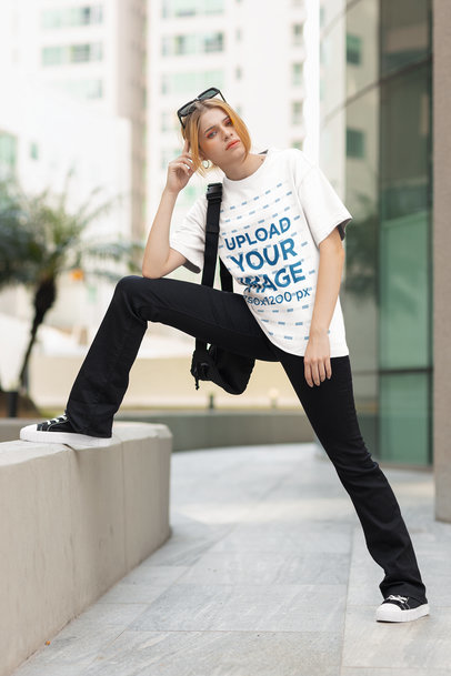 Round-Neck Tee Mockup of a Woman Posing in a Casual Outfit