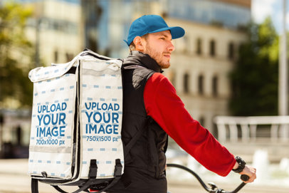 Delivery Backpack Mockup Featuring a Serious Bearded Man on a Bike