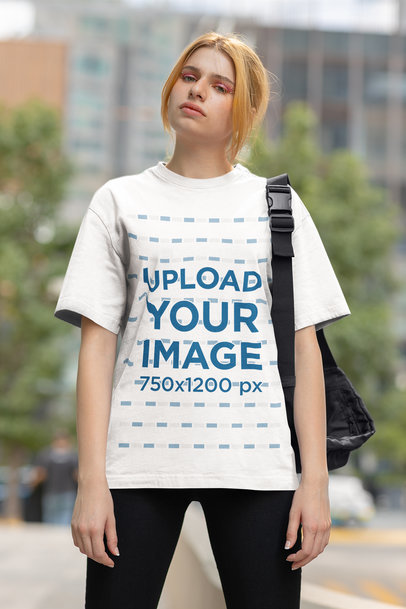 Rounded-Neck Tee Mockup of a Woman Standing on a Street