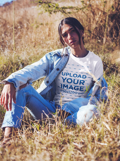 Woman Wearing a T-Shirt Mockup Lying Near Dry Plants