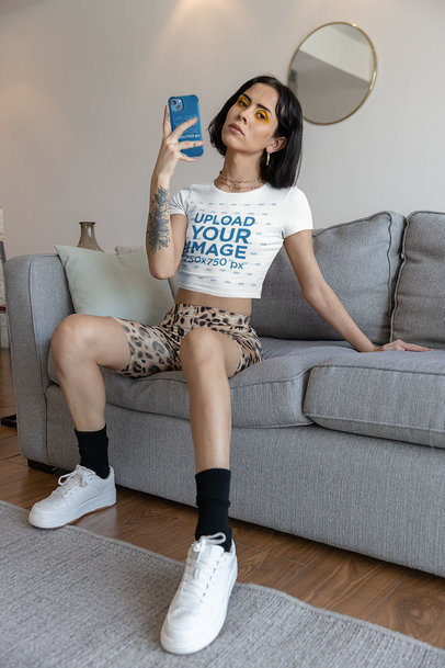 Bella Canvas Crop Top Mockup of a Tattooed Woman Taking a Mirror Selfie m29370