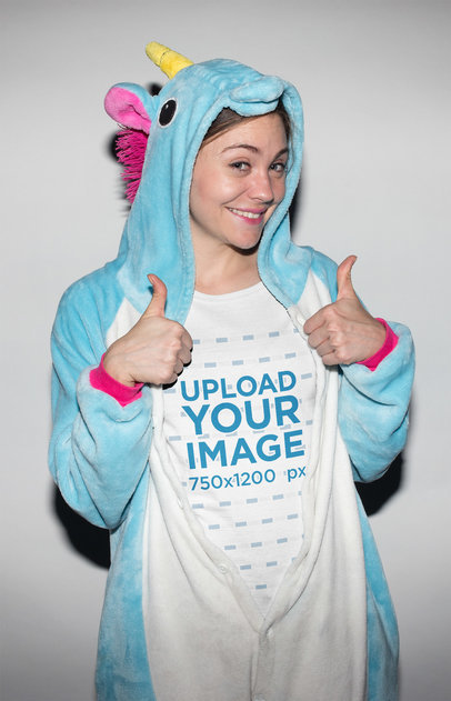 Geek Woman Wearing a T-Shirt Mockup with Unicorn Pajamas On