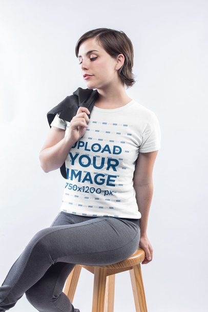 Woman Wearing a T-Shirt Template Sitting on a Wooden Stool