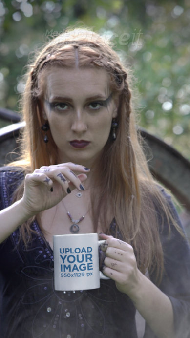 Mug Video Featuring a Serious Woman Wearing a Dark Outfit and Posing in a Wicca Setting