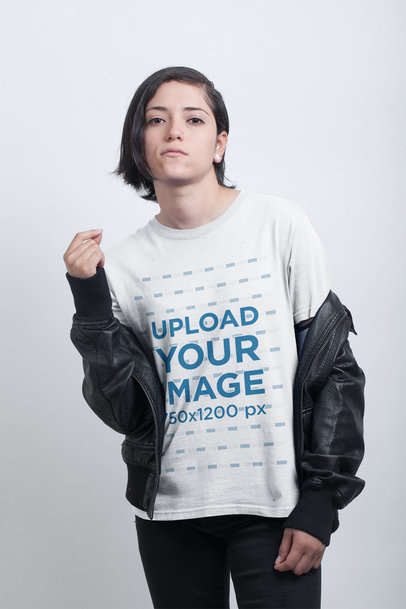 Woman with an Attitude Wearing a Tshirt Mockup Against a White Wall