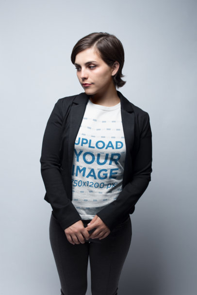 Beautiful Woman Wearing a Tshirt Mockup While Standing in a White Room
