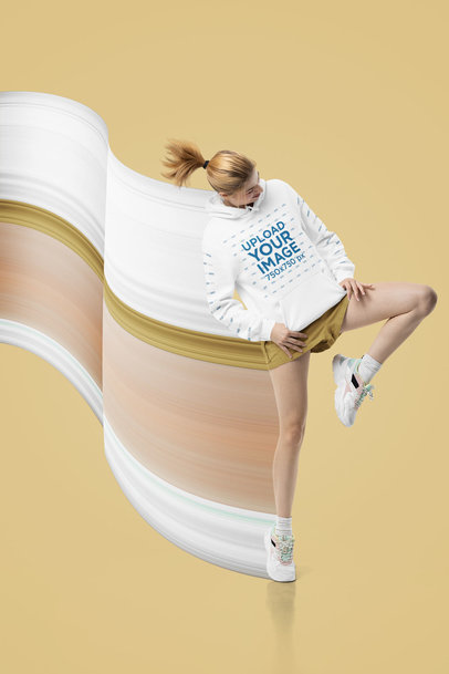Pullover Hoodie Mockup of a Woman Jumping at a Studio