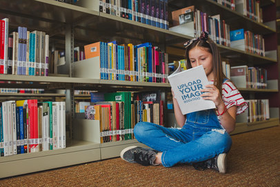 Girl Sitting with Crossed Legs Reading a Book Mockup at the Library